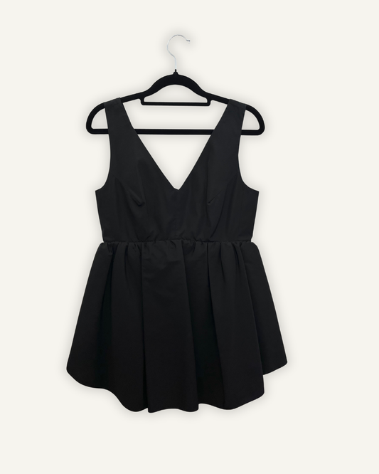 Blusa Carven smanicata con baschina a ruota